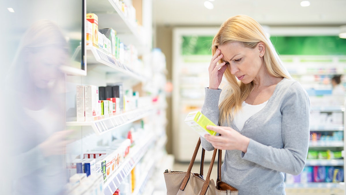 Woman with headache to do the pharmacy.
